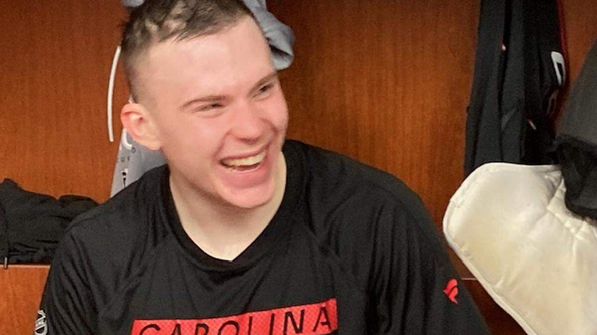 Defenseman Alexander Nikishin has a few laughs with his new Carolina Hurricanes teammates after his first practice with the team at Lenovo Center Saturday, April 19, 2025.