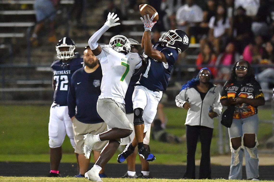 Cardinal Gibbons defensive back Xavier Hasan (7) defends the pass to Southeast Raleigh running back Coby Walker (1) during the second half. The Southeast Raleigh Bulldogs and the Cardinal Gibbons Crusaders met in a non-conference football game in Raleigh, N.C. September 12, 2025