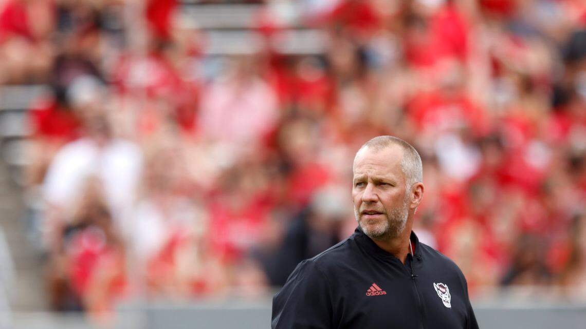N.C. State head coach Dave Doeren watches as his team warms up prior to a game against Charleston Southern on Saturday, Sept. 10, 2022, at Carter-Finley Stadium in Raleigh, N.C.