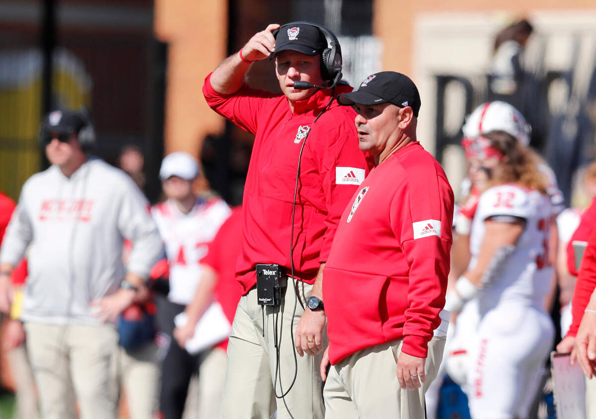 N.C. State head coach Dave Doeren talks with co-defensive coordinator Tony Gibson during the first half of N.C. State’s game against Wake Forest at BB&T Field in Winston-Salem, N.C., Saturday, Nov. 2, 2019.