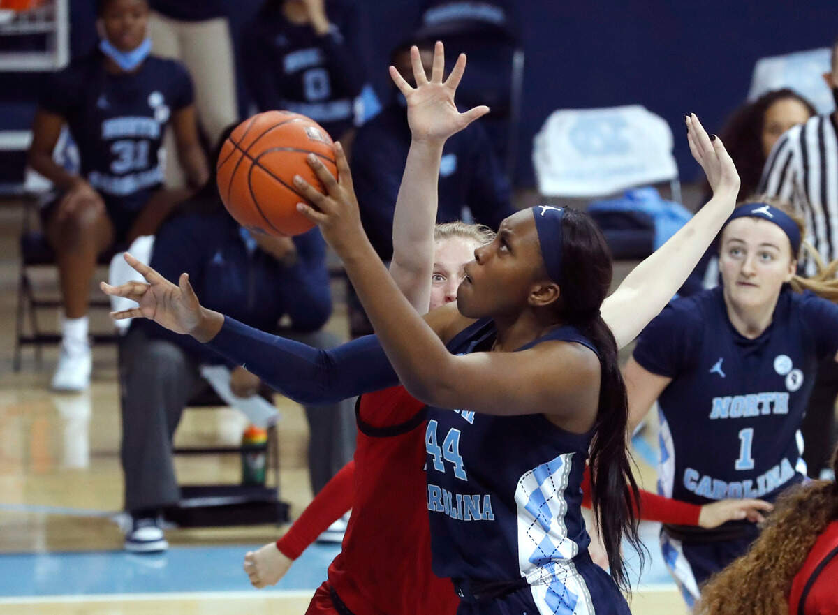 North Carolina’s Janelle Bailey (44) shoots as N.C. State’s Elissa Cunane (33) defends during the second half of UNC’s 76-69 victory over N.C. State at Carmichael Arena in Chapel Hill, N.C., Sunday, February 7, 2021.