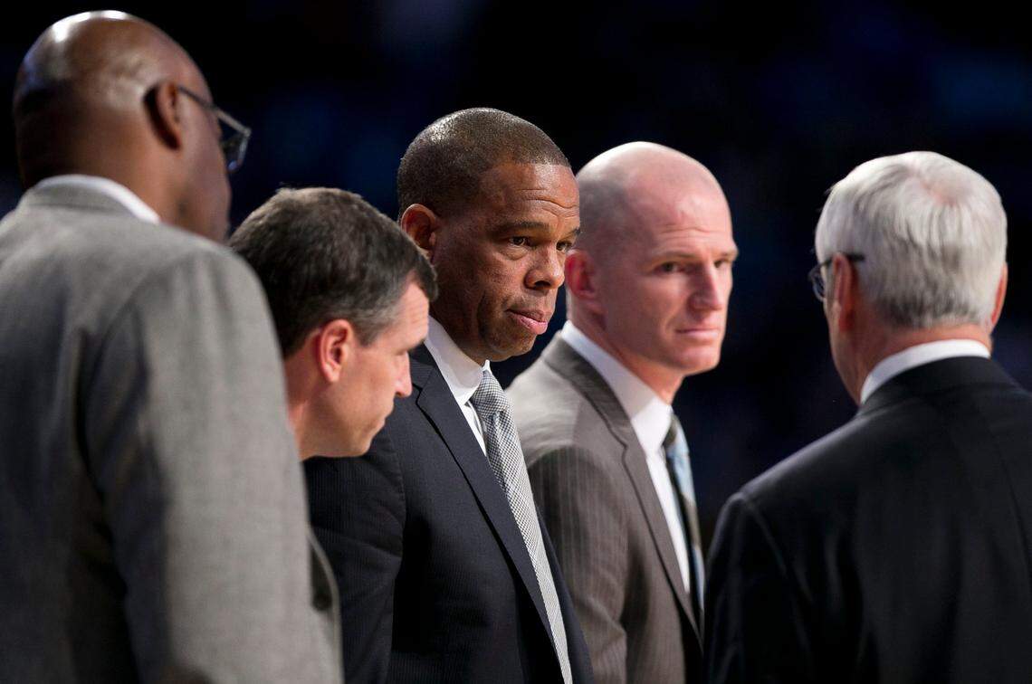 North Carolina assistants from left, Steve Robinson, C.B. McGrath, Hubert Davis and Brad Frederick listen to head coach Roy Williams during a time out in the second half on Saturday, December 31, 2016 at McCamish Pavillion in Atlanta, Georgia.