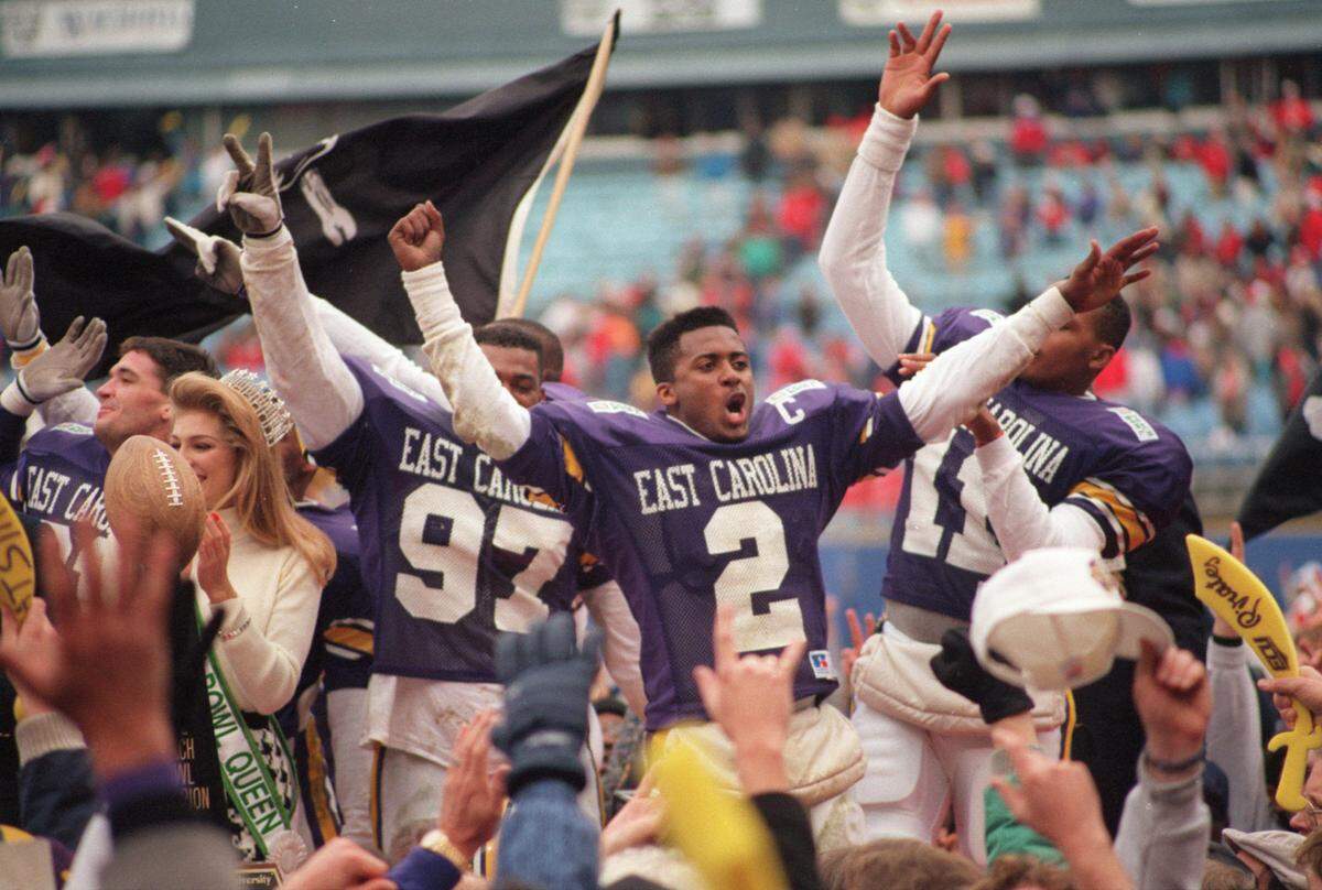 East Carolina players celebrate after winning the Peach Bowl in 1992 against N.C. State.