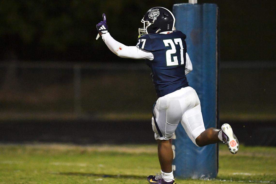 Southeast Raleigh running back James Adams IV (27) celebrates his touchdown against Cardinal Gibbons during the second half. The Southeast Raleigh Bulldogs and the Cardinal Gibbons Crusaders met in a non-conference football game in Raleigh, N.C. September 12, 2025