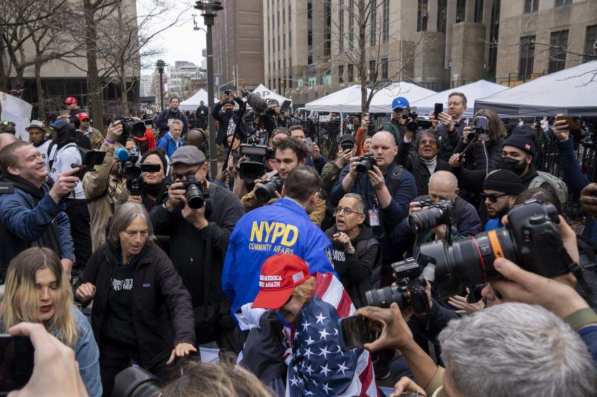 Protesters clash outside the Manhattan Criminal Courthouse in New York City on Tuesday, April 4, 2023.
