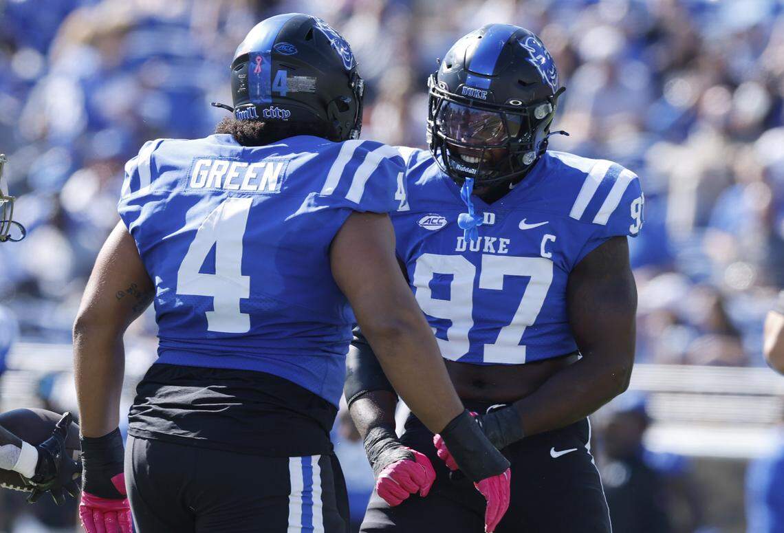 Duke’s Wesley Williams (97) celebrates with Josiah Green (4) after stopping Georgia Tech running back Jamal Haynes (1) during the first half of Duke’s game against Georgia Tech at Wallace Wade Stadium in Durham, N.C., Saturday, Oct. 18, 2025.