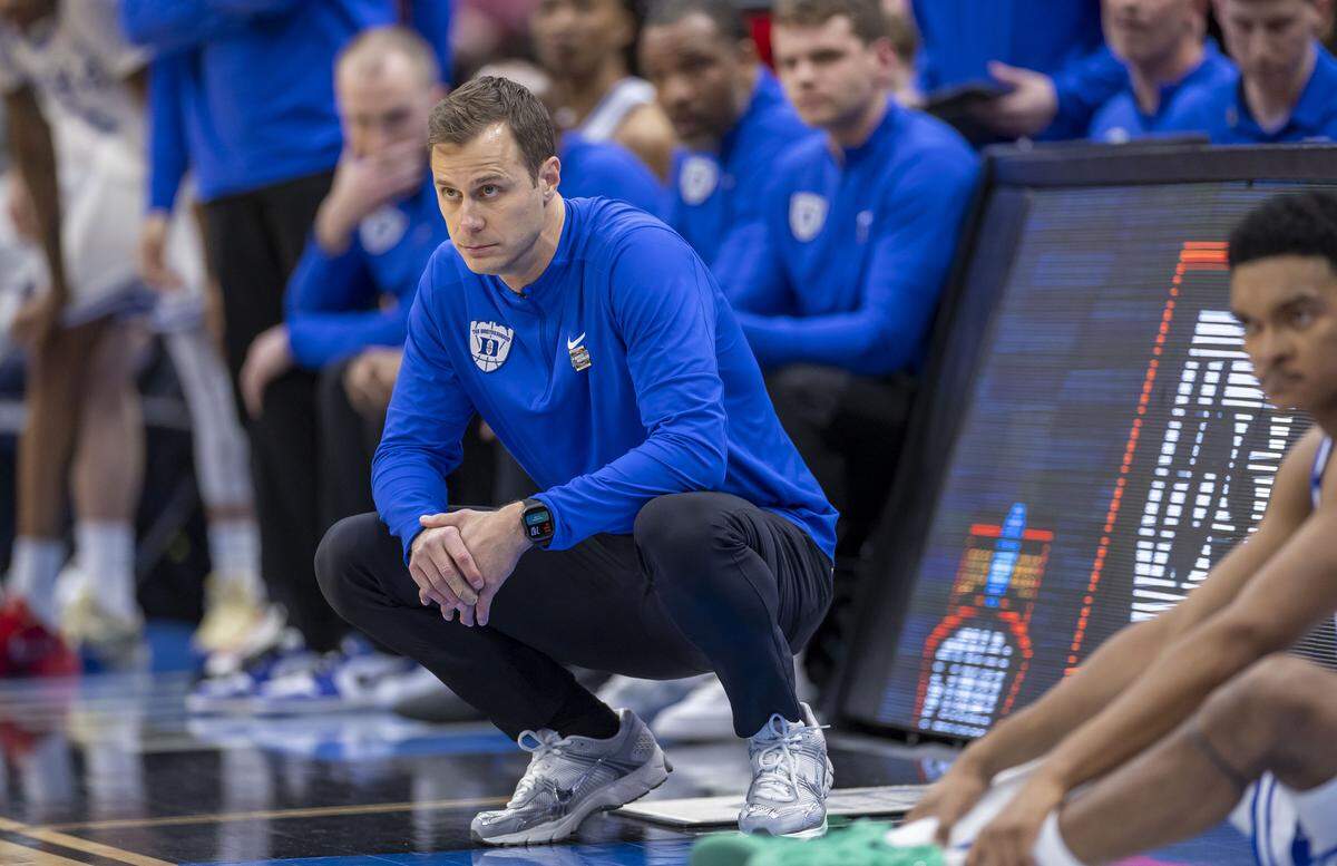 Duke coach Jon Scheyer watches as Connecticut cuts the Blue Devils’ lead to four points with two minutes to play on Sunday, March 29, 2026, in the NCAA East Regional Final, at Capital One Arena in Washington, D.C. The Blue Devils held a 19 point lead in the first half.
