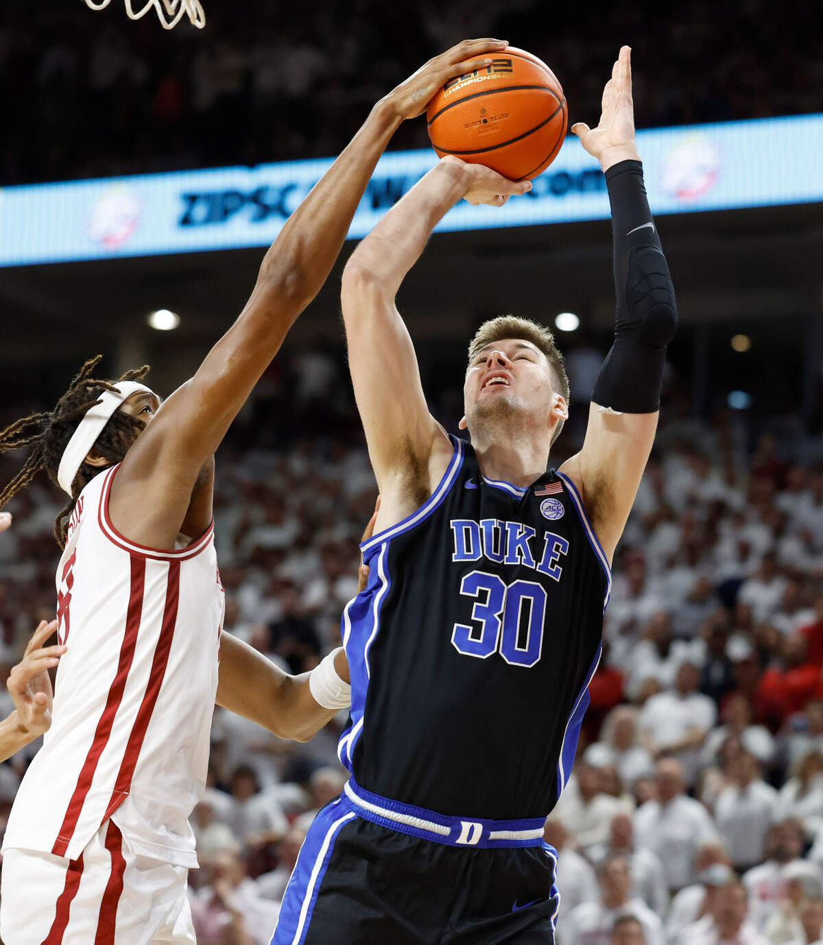 Arkansas’ Chandler Lawson (8) blocks the shot by Duke’s Kyle Filipowski (30) during the second half of Arkansas’ 80-75 victory over Duke at Bud Walton Arena in Fayetteville, Ark., Weds. Nov. 29, 2023.