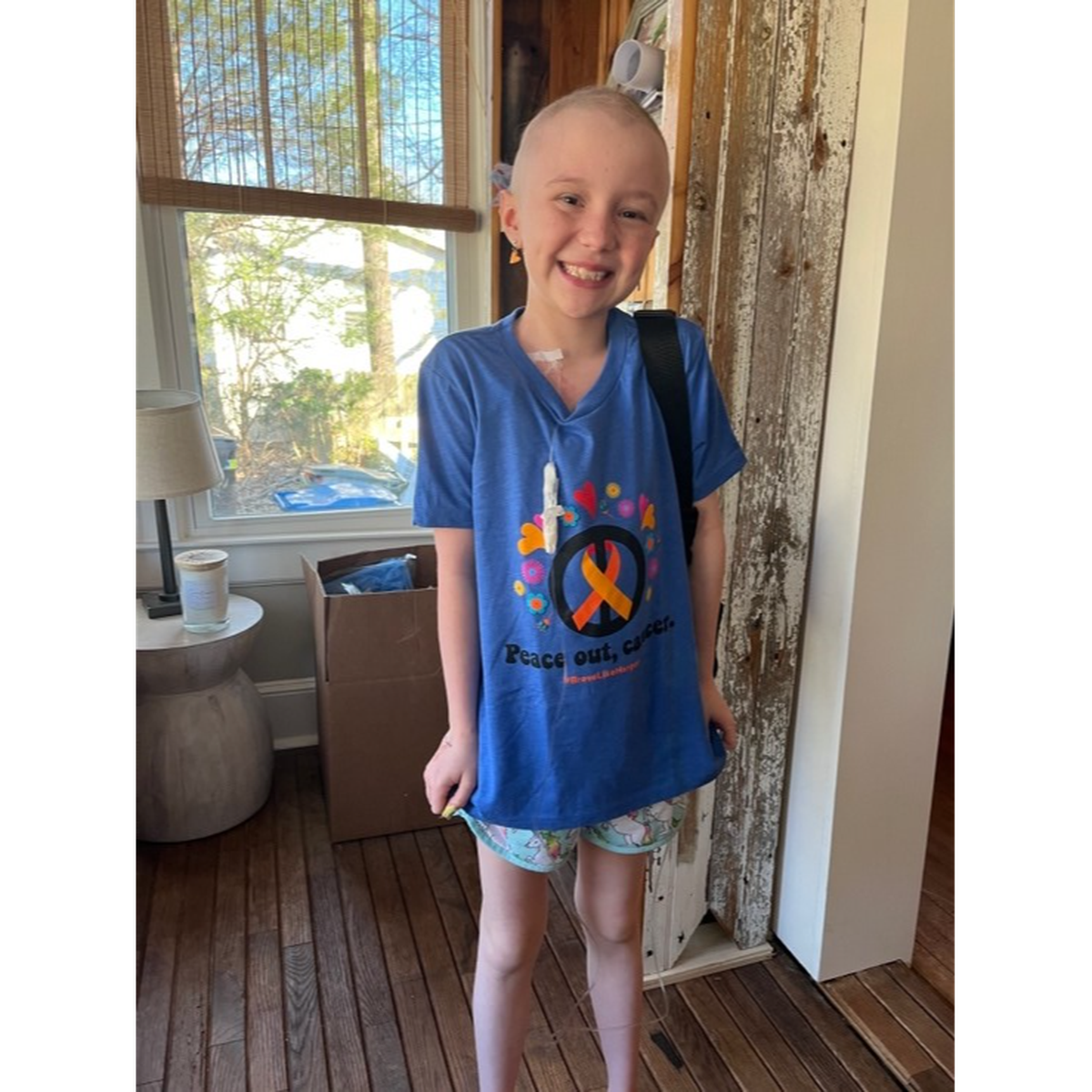 Harper Harrell, 9, has been fighting leukemia since October and is now cancer free on her scans. She designed this T-shirt to raise money for cancer research.