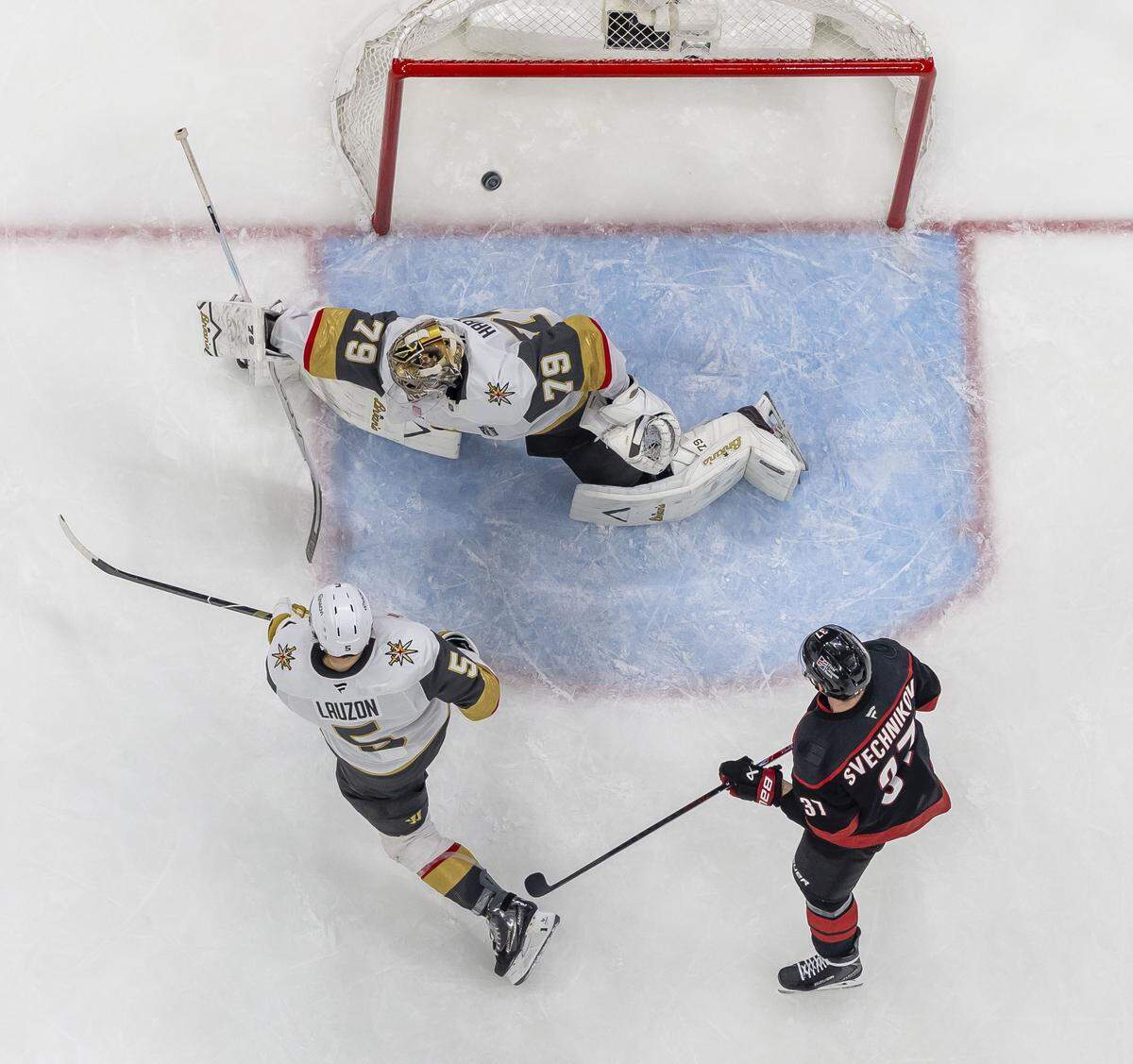 Vegas goalie Carter Hart (79), lets a shot by Carolina Hurricanes right wing Seth Jarvis, get past him in overtime, to secure a 4-3 victory in Game 2 of the Stanley Cup Final, on Thursday, June 4, 2026 at Lenovo Center in Raleigh, N.C.