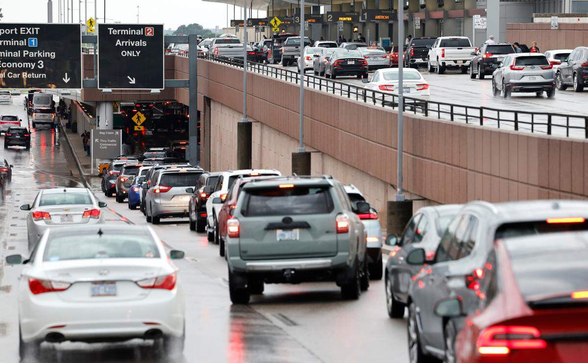 Vehicles line up to pick up passengers at Terminal 2 at Raleigh-Durham International Airport in Morrisville, N.C., early Friday evening, May 17, 2024.