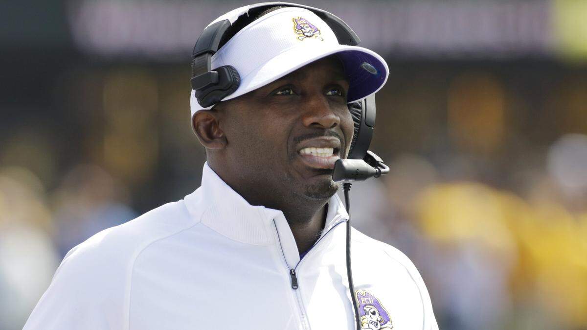 East Carolina head coach Scottie Montgomery watches his team during the second half of an NCAA college football game against West Virginia, Saturday, Sept. 9, 2017, in Morgantown, W.Va. West Virginia defeated East Carolina 56-20. The Pirates hope defensive end Kendall Futrell will lead an improved defense this season.