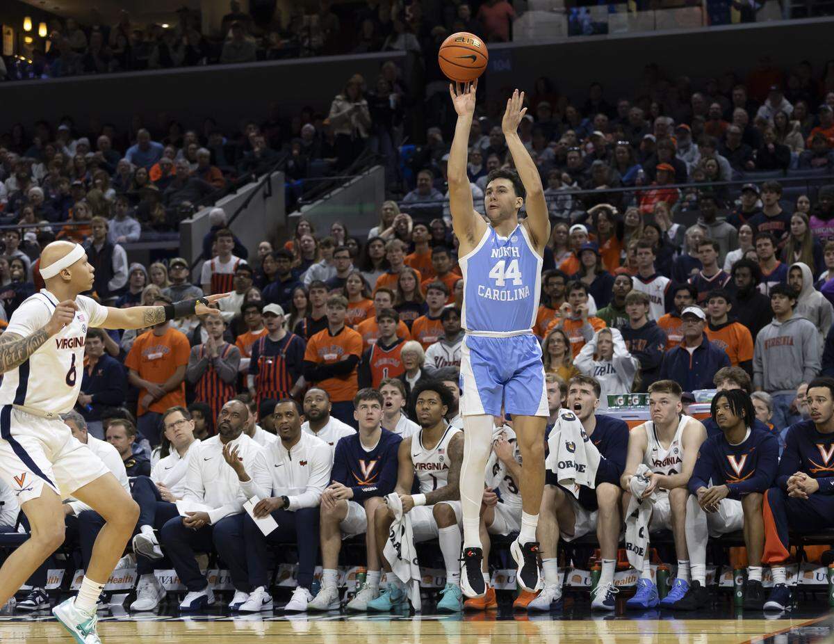 North Carolina guard Luka Bogavac (44) launches a three-point shot in front of the Virginia bench during the first half on Saturday, January 24, 2026 at John Paul Jones Arena in Charlottesville, Va.