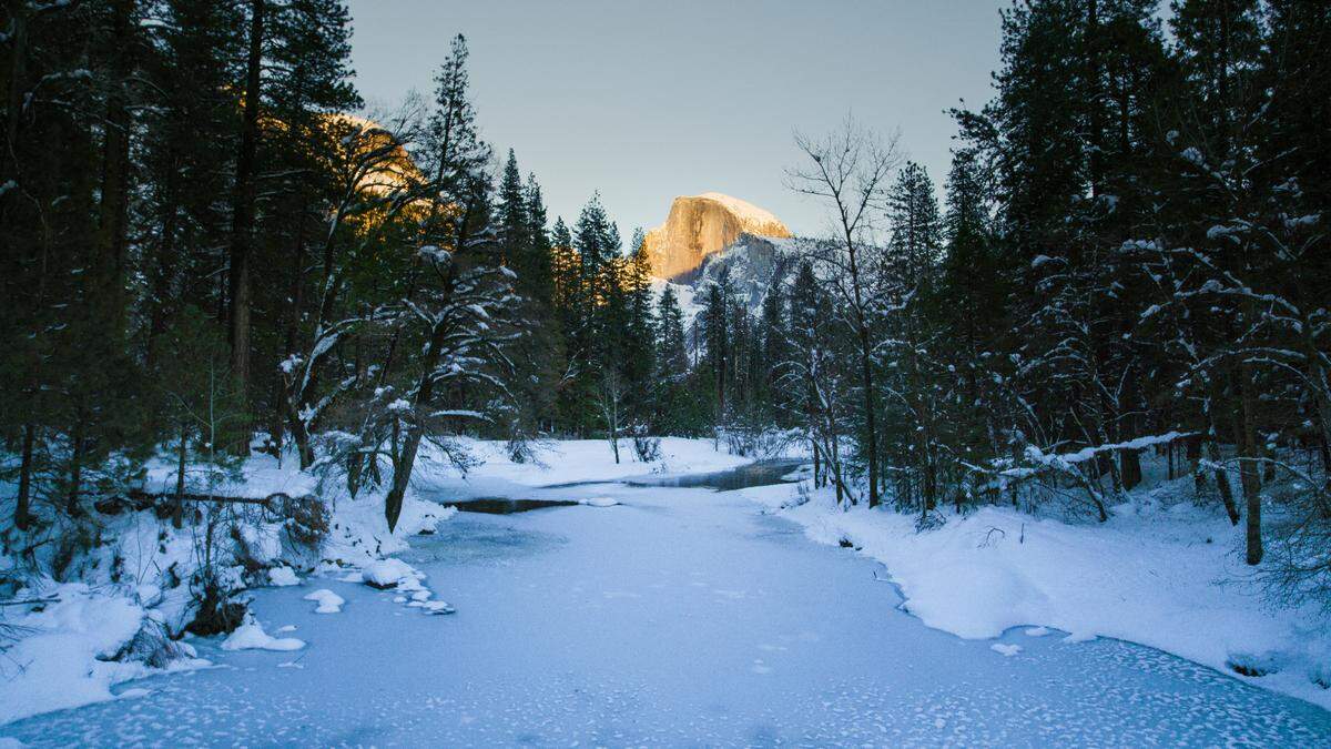 Yosemite National Park in the snow with a view of Half Dome, from Episode 2 of the National Geographic Channel documentary series “America’s National Parks.”