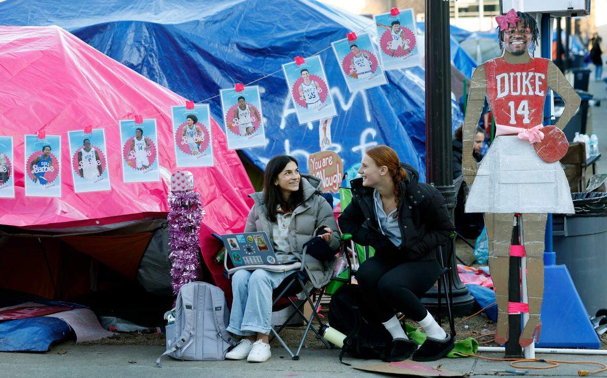 Duke seniors Kendra Rentz, left, Claire Helgerson hang out outside their tent in Krzyzewskiville at Duke University in Durham, N.C., Tuesday, Jan. 28, 2025. The is the 39th year of tenting for students who want to attend the game against UNC. One hundred thirty tents were set up on Jan. 12, with 12 students per tent. It is the only way undergraduates can go to the game.