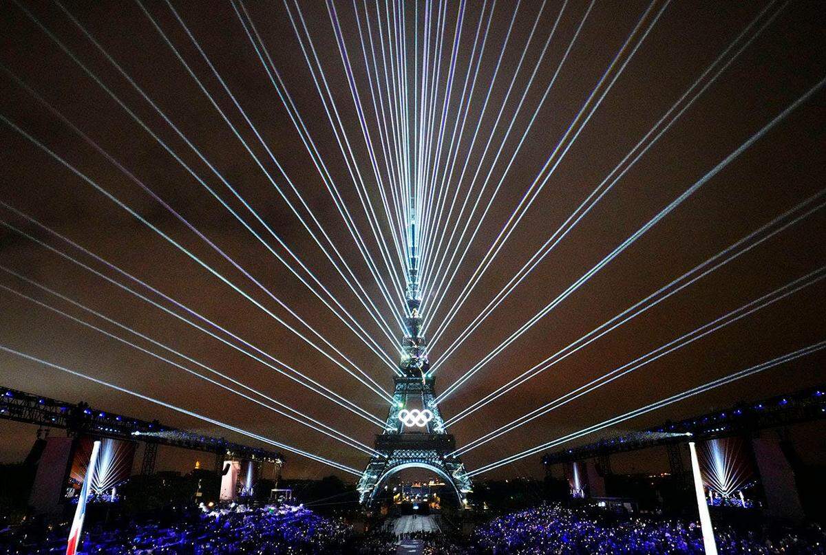 A laser show with the Eiffel Tower as seen from the Trocadero during the Opening Ceremony for the Paris 2024 Olympic Summer Games along the Seine River on July 26, 2024.