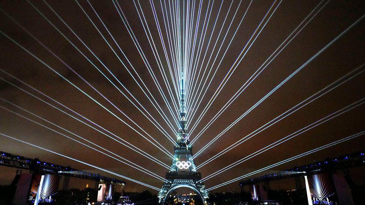 A laser show with the Eiffel Tower as seen from the Trocadero during the Opening Ceremony for the Paris 2024 Olympic Summer Games along the Seine River on July 26, 2024.