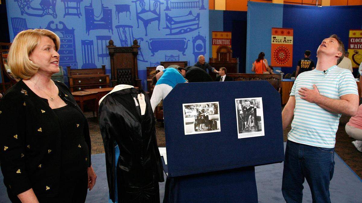 A man gets an appraisal on a dress worn by Marilyn Monroe in the film “Some Like it Hot” at an “Antiques Roadshow” event in Palm Springs, California, in 2008.