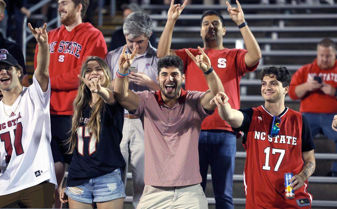 Wolfpack fans celebrate as time runs out during the Wolfpack’s 24-14 victory over UConn at Rentschler Field in East Hartford, Conn. Thursday, August 31, 2023.