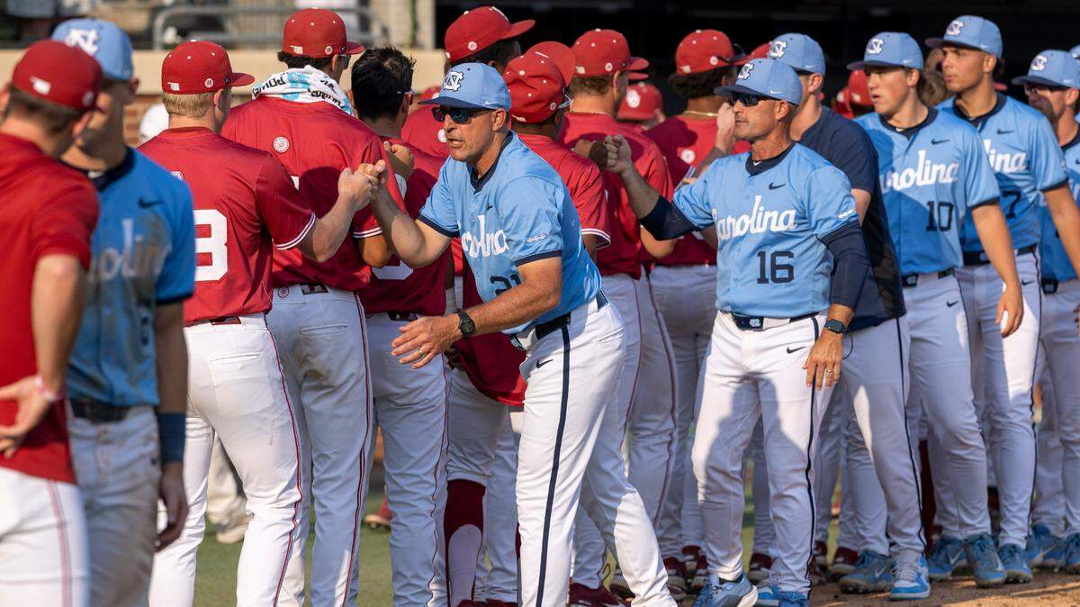 North Carolina coach Scott Forbes shakes hands with members of the Oklahoma baseball team following the Tar Heels’ 14-4 victory in Game 7 of the NCAA Chapel Hill Regional on Monday, June 2, 2025 at Boshamer Stadium in Chapel Hill, N.C.