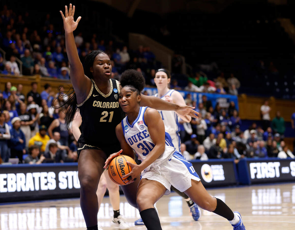 Duke’s Shayeann Day-Wilson drives to the basket past Colorado’s Aaronette Vonleh during overtime of the Blue Devils’ 61-53 loss to Colorado in an NCAA Tournament second round game at Cameron Indoor Stadium on Monday, March 20, 2023, in Durham, N.C.