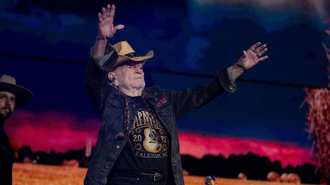Willie Nelson greets the crowd at Farm Aid at Raleigh, N.C.’s Coastal Credit Union Music Park at Walnut Creek, Saturday, Sept. 24, 2022.