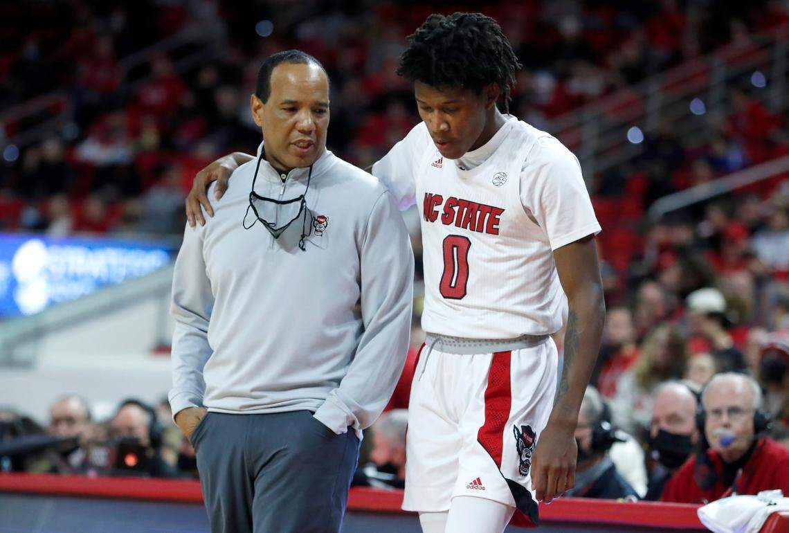 N.C. State head coach Kevin Keatts talks with Terquavion Smith (0) during the second half of Wright State’s 84-70 victory over N.C. State at PNC Arena in Raleigh, N.C., Tuesday, December 21, 2021.