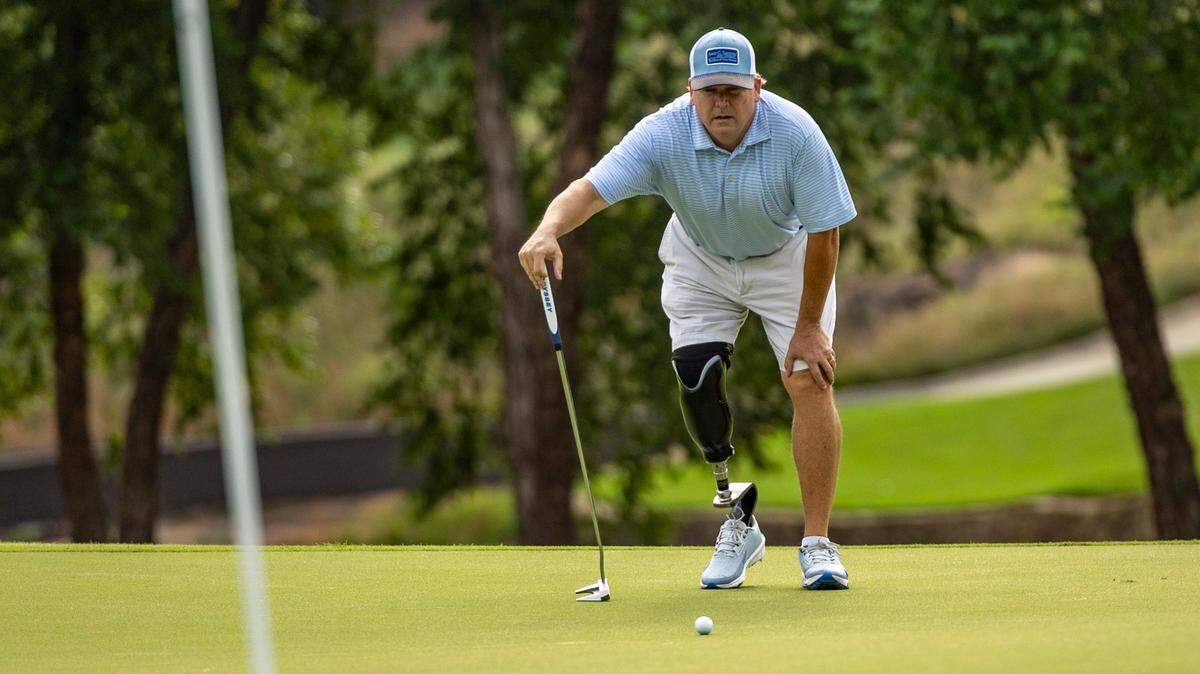 Garrett Smyth, 55, plays a round of golf on Wednesday, July 2, 2025, at Carolina Country Club in Raleigh. Smyth will compete in the U.S. Adaptive Open for the first time this week in Maryland. A four-time bone cancer survivor, he had his right leg amputated below the knee in 2023 and rediscovered his love for competitive golf.