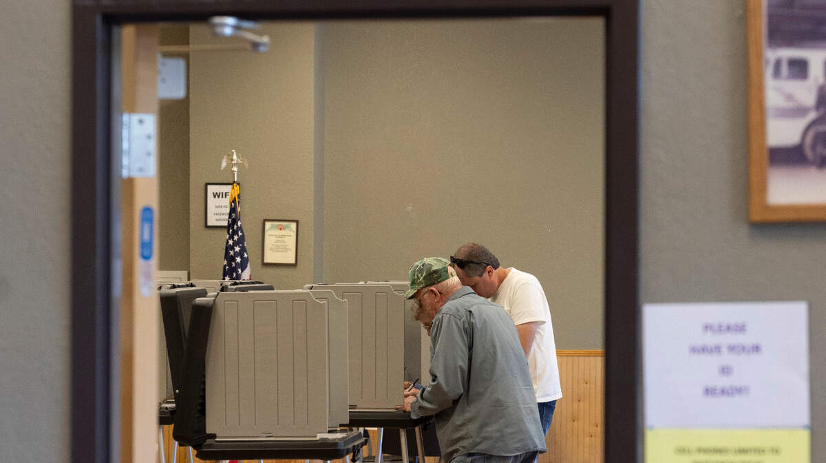 Voters mark their ballots at the Fire Department polling site in Mitchell County on Thursday, October 17, 2024 in Spruce Pine, N.C.