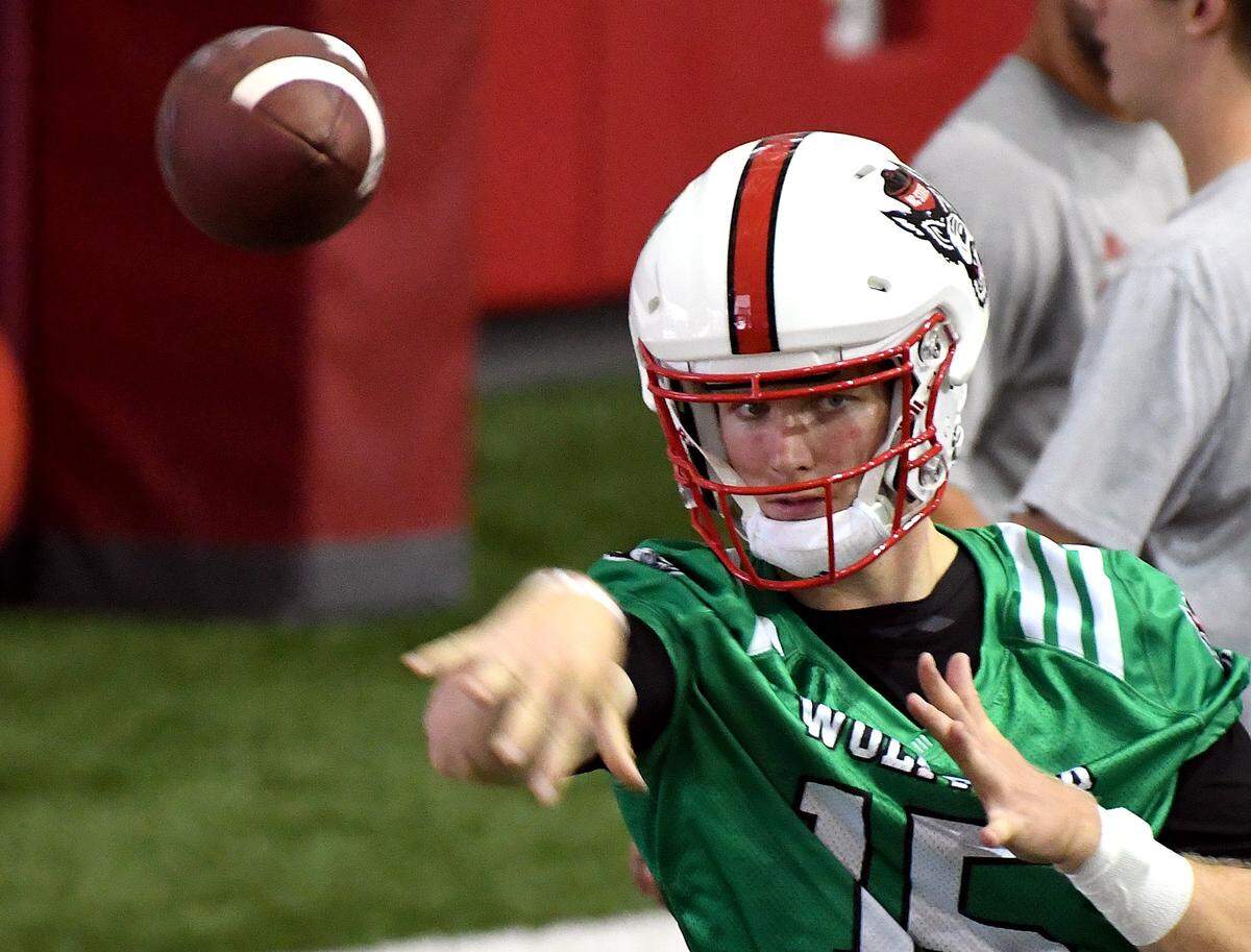 NC State quarterback Ryan Finley (15) works out during the first day of practice at the Wolfpack’s indoor practice facility in Raleigh, N.C. Friday, August 3, 2018.