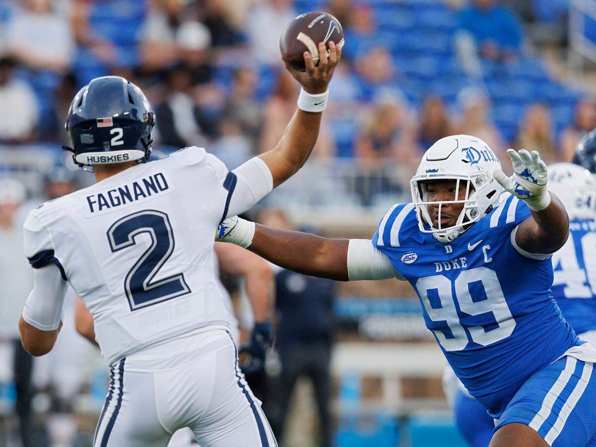 Duke’s Aaron Hall pressures Connecticut’s Joe Fagnano during the first half of the Blue Devils’ game on Saturday, Sept. 14, 2024, at Wallace Wade Stadium in Durham, N.C.