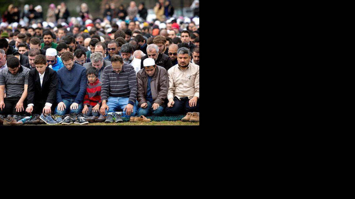 Mourners pray during the funeral service Thursday for Deah Barakat, his wife Yusor Abu-Salha and her sister Razan Abu-Salha. Mohammad ElGamal, chairman of the Islamic Association of Raleigh, which conducted the funeral, said their deaths were ‘violence against humanity.’
