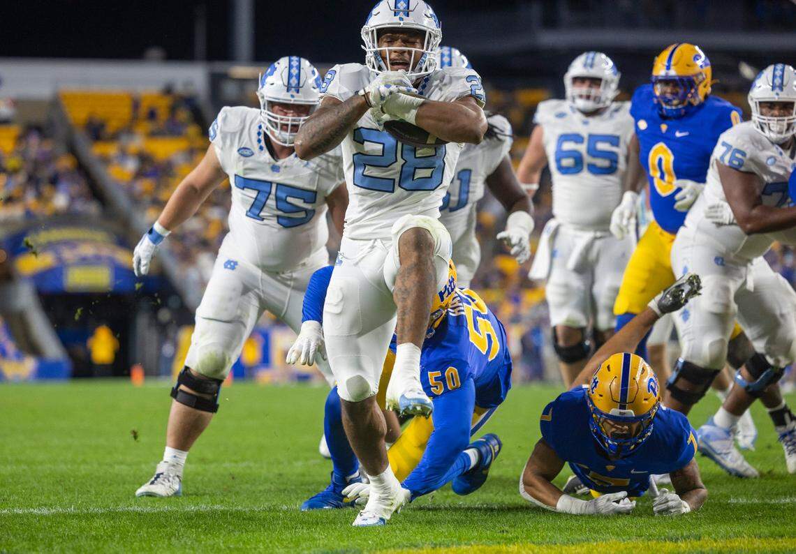 North Carolina running back Omarion Hampton (28) scores on three-yard run to tie Pitt 7-7 in the first quarter on Saturday, September 23, 2023 at Acrisure Stadium in Pittsburgh, Pa.