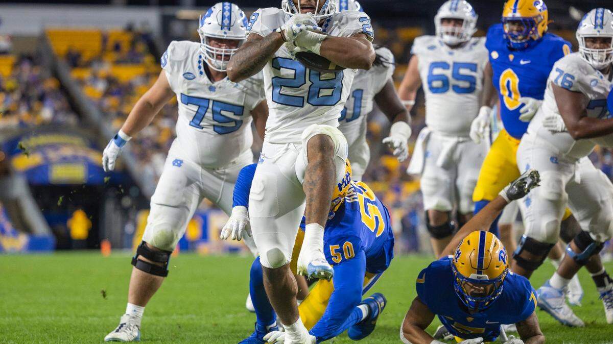 North Carolina running back Omarion Hampton (28) scores on three-yard run to tie Pitt 7-7 in the first quarter on Saturday, September 23, 2023 at Acrisure Stadium in Pittsburgh, Pa.