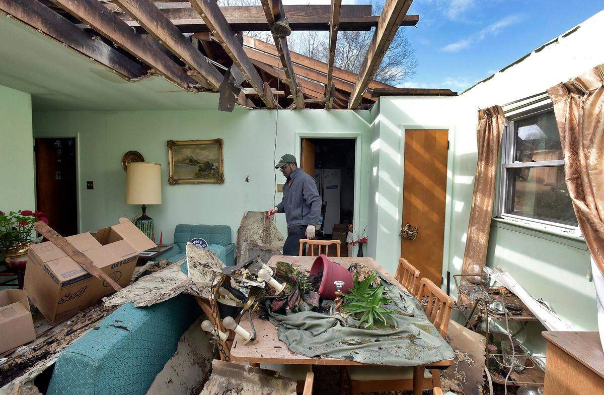 Nick Sims, 18, surveys the damage to his grandmother’s house in Greensboro, N.C. Monday, April 16, 2018. A tornado ripped through this eastern Greensboro neighborhood destroying several houses. Sims’ grandmother was not injured.