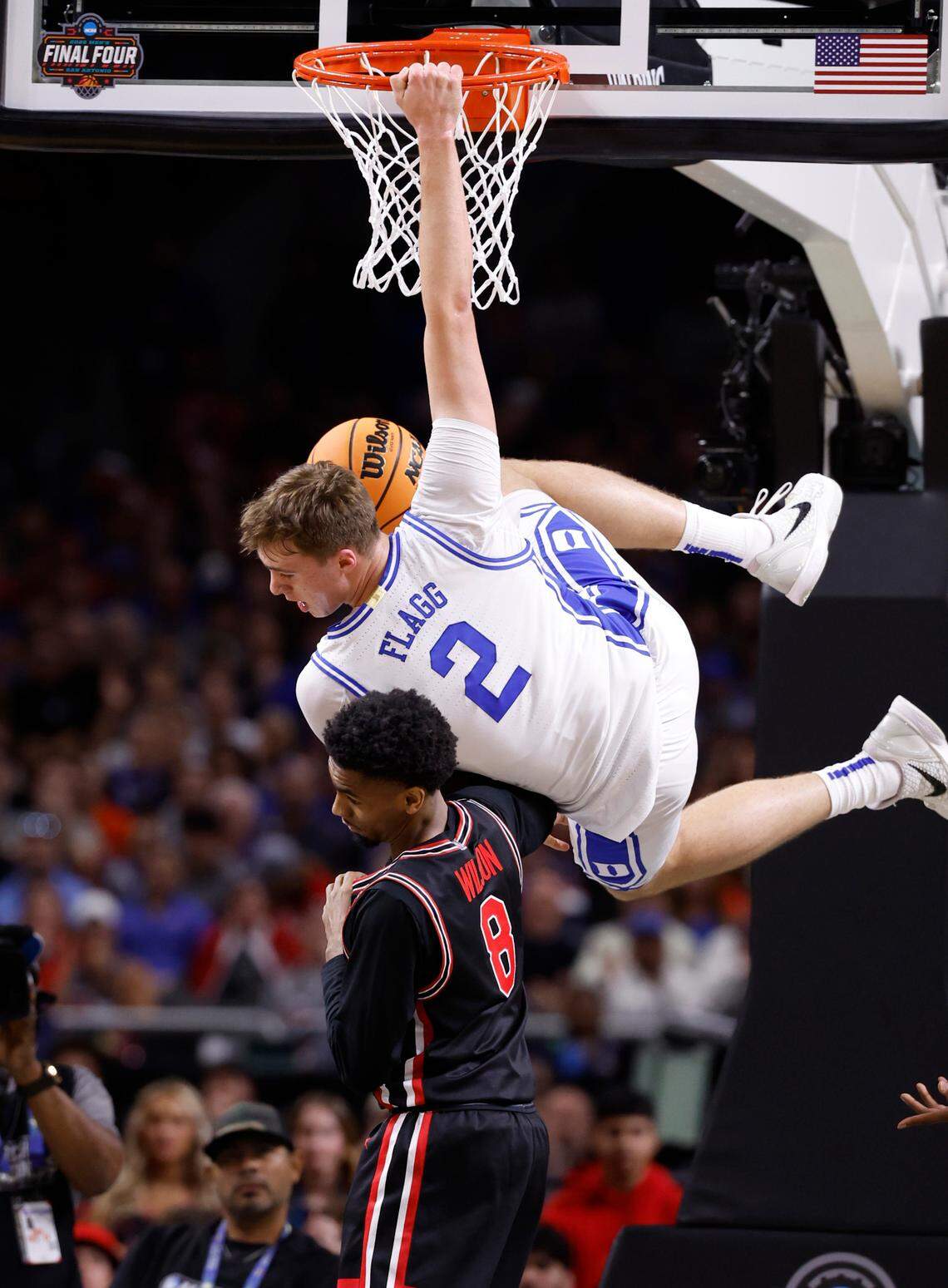 Duke’s Cooper Flagg (2) slams in two over Houston’s Mylik Wilson (8) during the first half of Duke’s game against Houston in the NCAA men’s national semifinal at the Alamodome in San Antonio, Texas, Saturday, April 5, 2025.