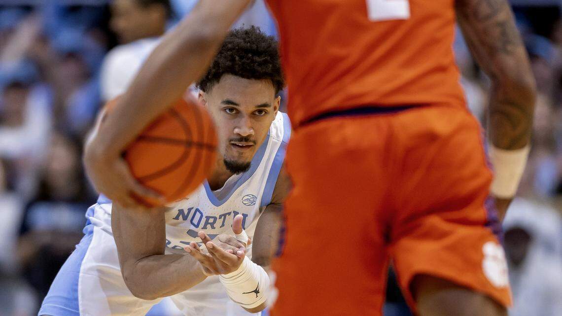 North Carolina guard Seth Trimble (7) reacts after connecting for a three-point basket to open the game, and steps up to defend Clemson guard Dillon Hunter (2) on Tuesday, March 3, 2026 at the Smith Center in Chapel Hill, N.C.
