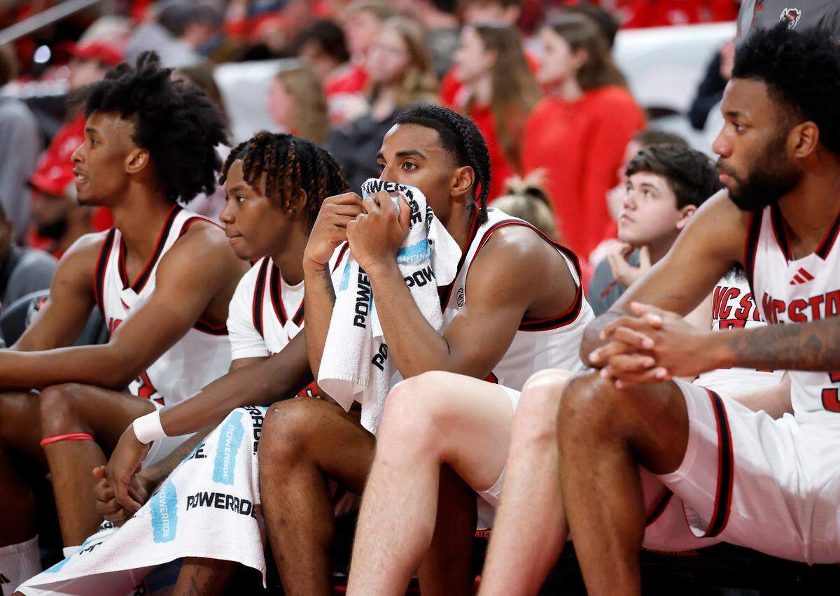 The N.C. State bench watches during the second half of the Wolfpack’s 91-66 loss to Louisville on Wednesday, Feb. 12, 2025, at Lenovo Center in Raleigh, N.C.