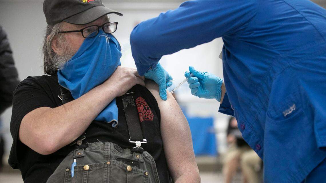 Michael McGrath of Lillington, N.C., receives his second dose of the COVID-19 vaccine during a mass vaccination clinic at the Dunn Community Center on Friday, Feb. 12, 2021 in Dunn, N.C.