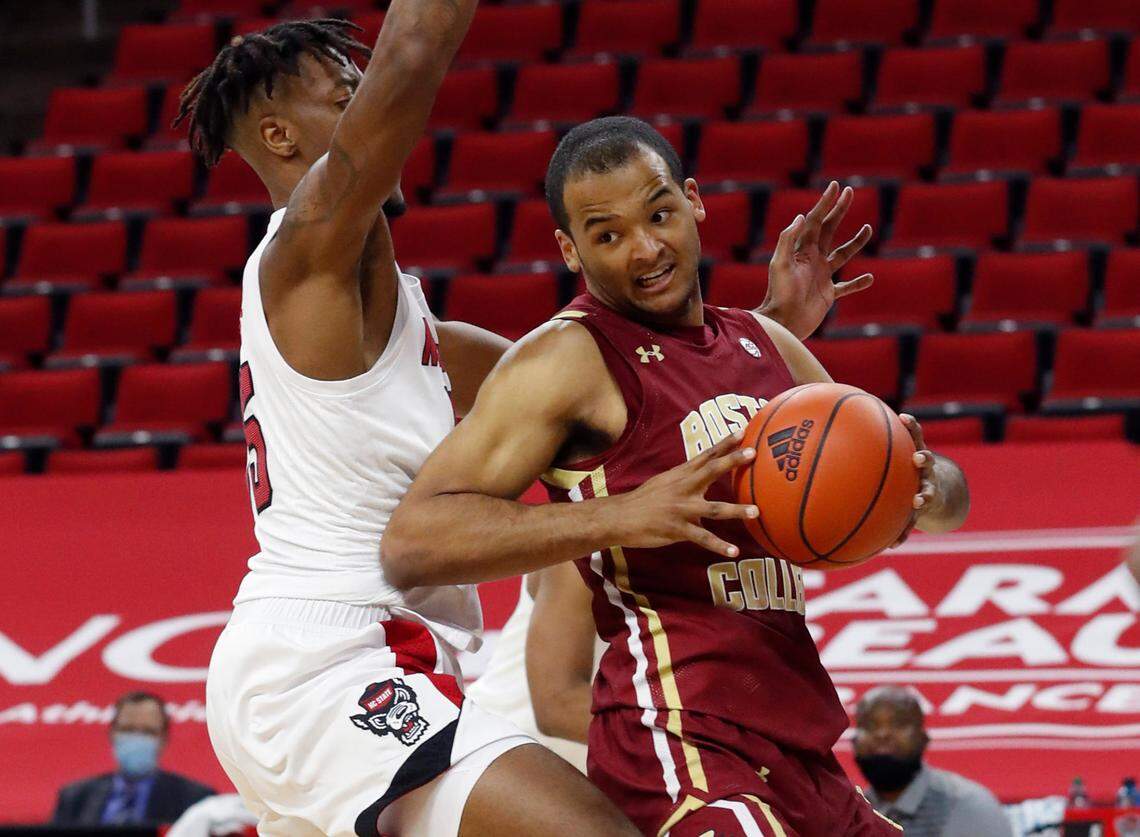Boston College’s Steffon Mitchell (41) looks for room as N.C. State’s Manny Bates (15) guards him during the first half of N.C. State’s game against Boston College at PNC Arena in Raleigh, N.C., Wednesday, December 30, 2020.