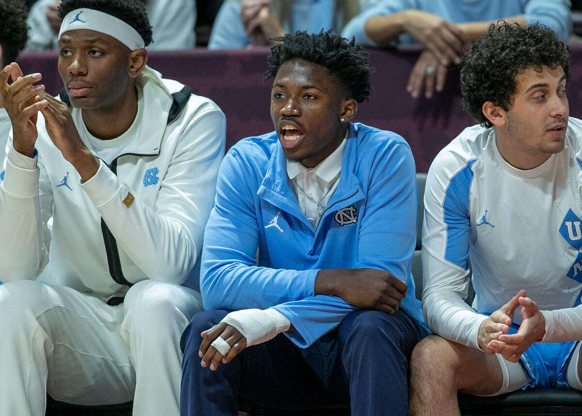 North Carolina’s D’Marco Dunn (11) watches the second half against Virginia Tech from the bench on Sunday, December 4, 2022 at Cassell Coliseum in Blacksburg, Va. Dunn broke a bone in his hand on Saturday during practice.