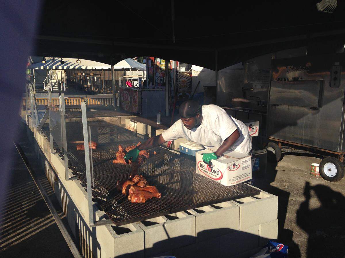 Douglas Price of McBride’s gets the giant turkey legs ready for the N.C. State Fair’s opening on Friday, Oct. 12, 2018.
