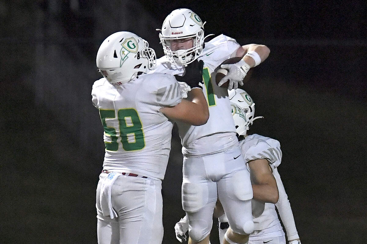 Cardinal Gibbons’ Aidan Kranick (58) celebrates withwide receiver Joey Jonske’s (11) touchdown against Leesville Road during the first half. The Leesville Road Pride and the Cardinal Gibbons Crusaders met in a conference football game in Raleigh, N.C. on November 1, 2024.