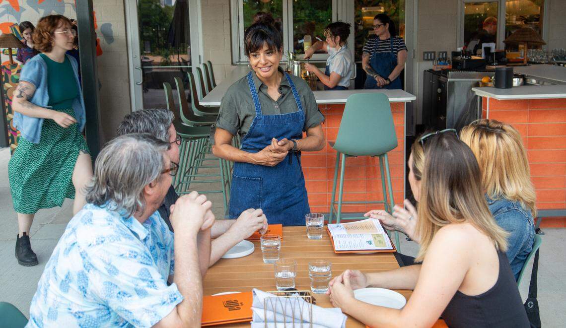 Cheetie Kumar talks with guests during a soft opening Thursday June 15, 2023 at Ajja, a new restaurant from Cheetie Kumar and Paul Siler in on Bickett Blvd. in Raleigh. Ajja focuses on Mediterranean, Middle Eastern and Southwest Asian flavors.
