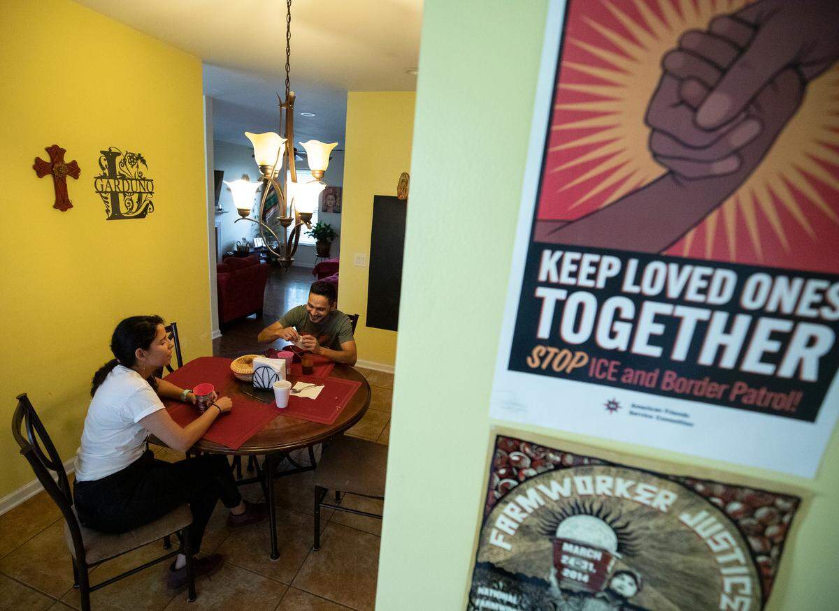 Laura Garduño-García eats dinner with her husband, Vicente Alvarez, in Greensboro, N.C. on Thursday, May 26, 2022.