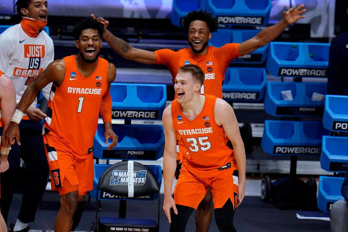 Syracuse’s Quincy Guerrier (1), Buddy Boeheim (35) and Alan Griffin celebrate a teammate’s 3-point shot late in the second half against San Diego State in a college basketball game in the first round of the NCAA men’s tournament at Hinkle Fieldhouse in Indianapolis, Friday, March 19, 2021. 