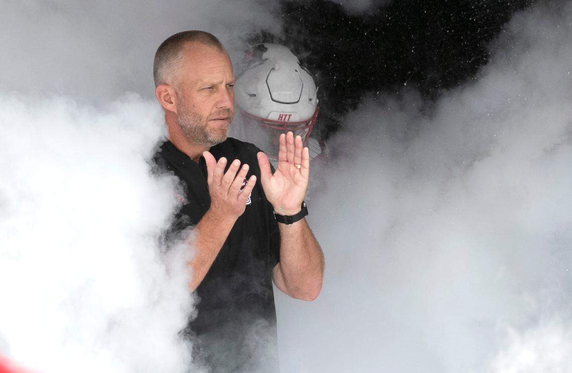 N.C. State head coach Dave Doeren heads out onto the field before the Wolfpack’s game against Charleston Southern at Carter-Finley Stadium in Raleigh, N.C., Saturday, Sept. 10, 2022.