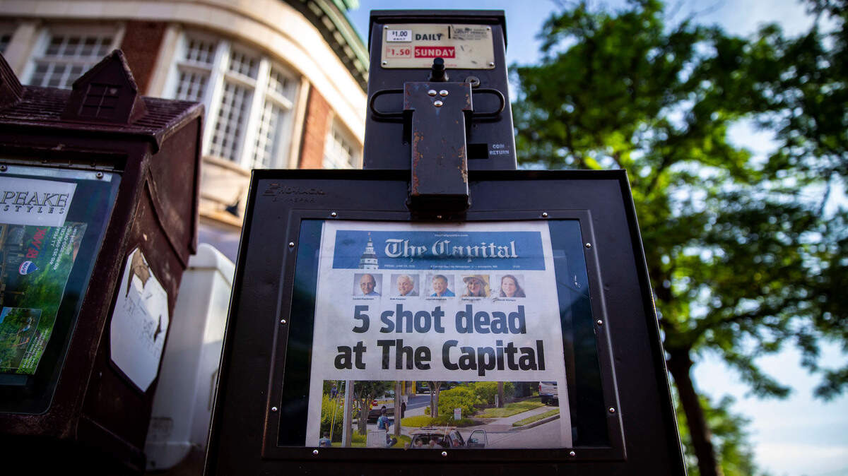 The front page of the Capital Gazette, the morning after a gunman attacked the newsroom, in downtown Annapolis, Md., June 29, 2018. Five people were killed and two others were injured Thursday in the shooting at the community newspaper chain. The suspect in the attack, Jarrod Ramos, was arrested at the scene and charged Friday morning with five counts of murder.