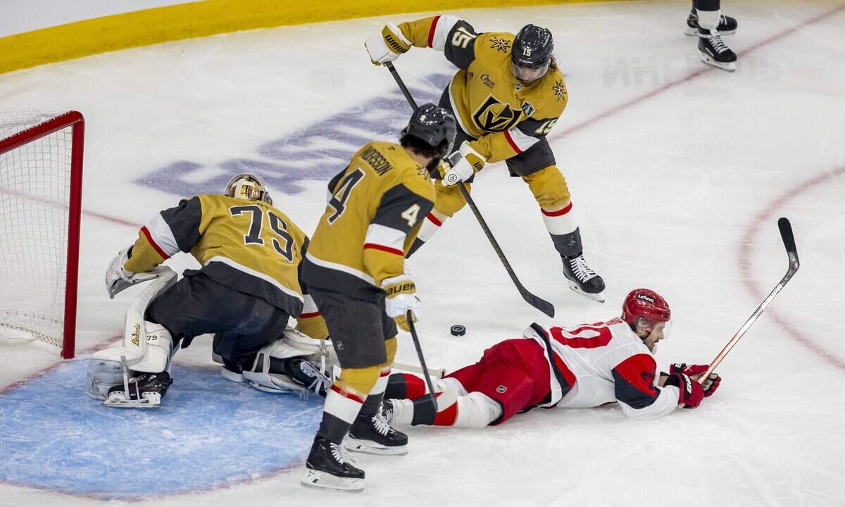 Carolina Hurricanes center Sebastian Aho (20) is denied a scoring attempt by Vegas goalie Carter Hart (79) as defenseman Noah Hanifin (15) clears the puck, in the first period in Game 3 of the Stanley Cup Final, on Saturday, June 6, 2026 at T-Mobile Arena in Las Vegas, NV.