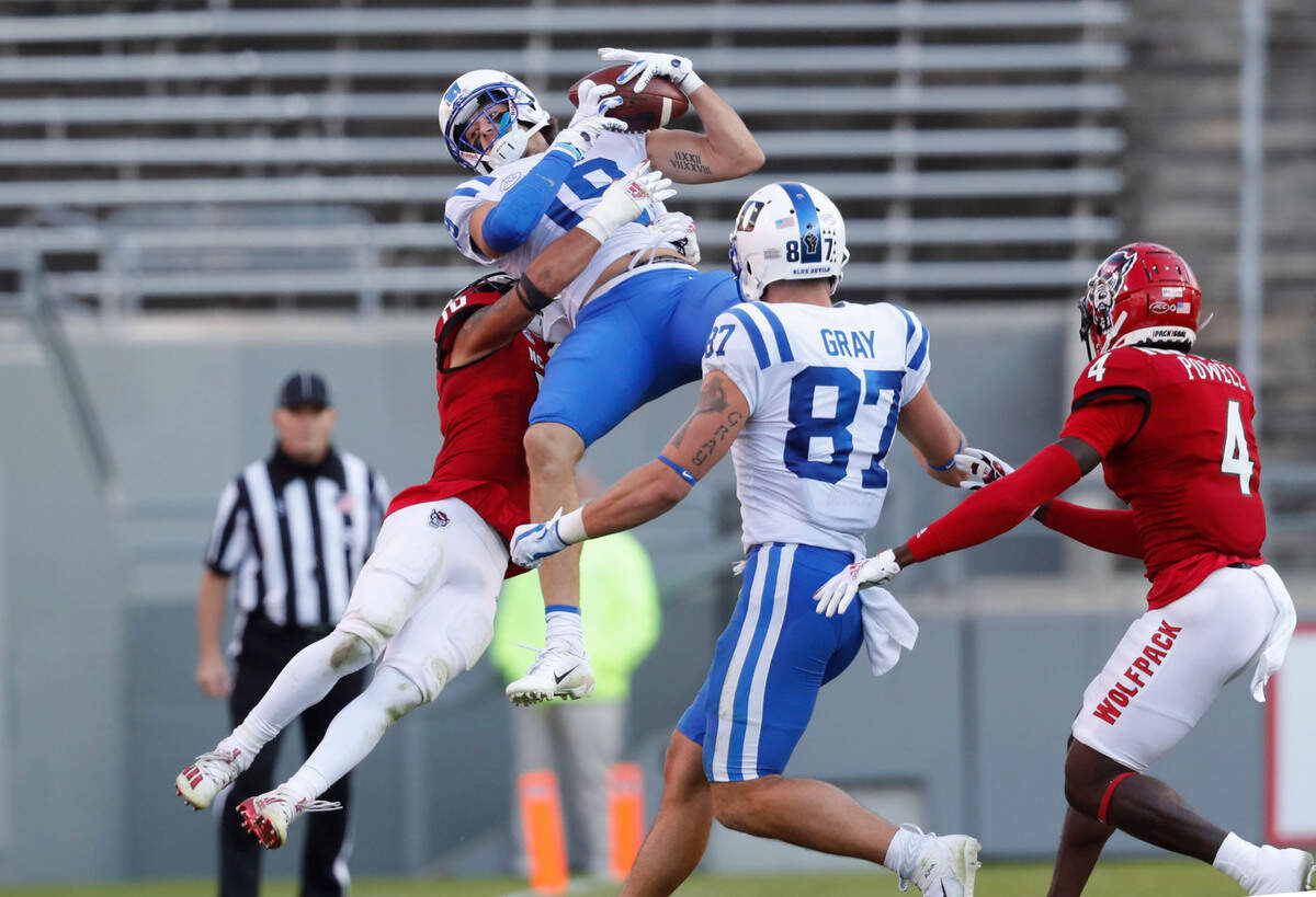 Duke wide receiver Jake Bobo (19) makes the reception as N.C. State safety Tanner Ingle (10) defends during the first half of N.C. State’s game against Duke at Carter-Finley Stadium in Raleigh, N.C., Saturday, Oct. 17, 2020.